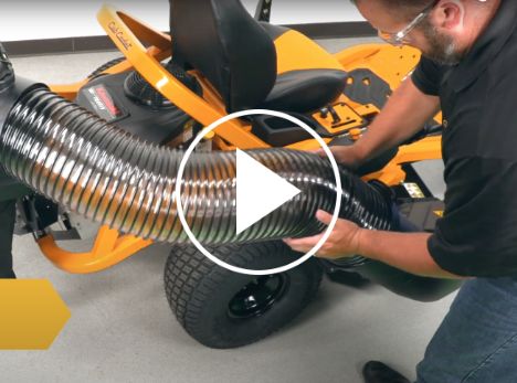 person installing bagger attachment