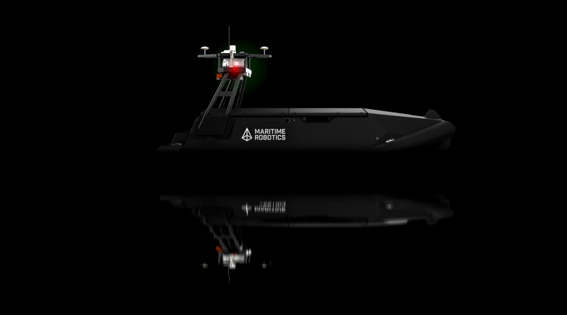 Studio-rendered side view of the Mariner USV showing sleek black hull and navigation lights reflected on a black surface.