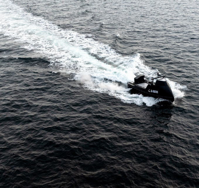 Mariner X uncrewed sea drone cruising at high speed across open waters, leaving a dynamic wake behind.