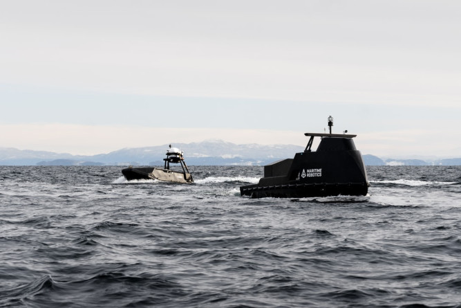 Two different autonomous vessels (Mariner X and Mariner) from Maritime Robotics on a joint maritime mission in the Norwegian fjord.