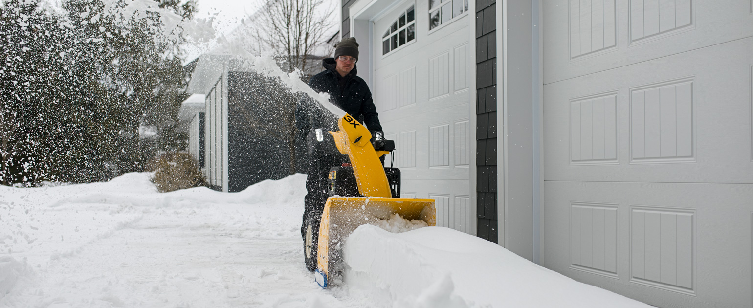 man-operating-cub-cadet-snow-blower